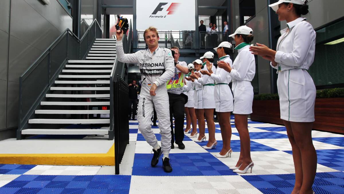 Nico Rosberg of Germany and Mercedes GP celebrates as he makes his way to the podium. PHOTOS: GETTY IMAGES
