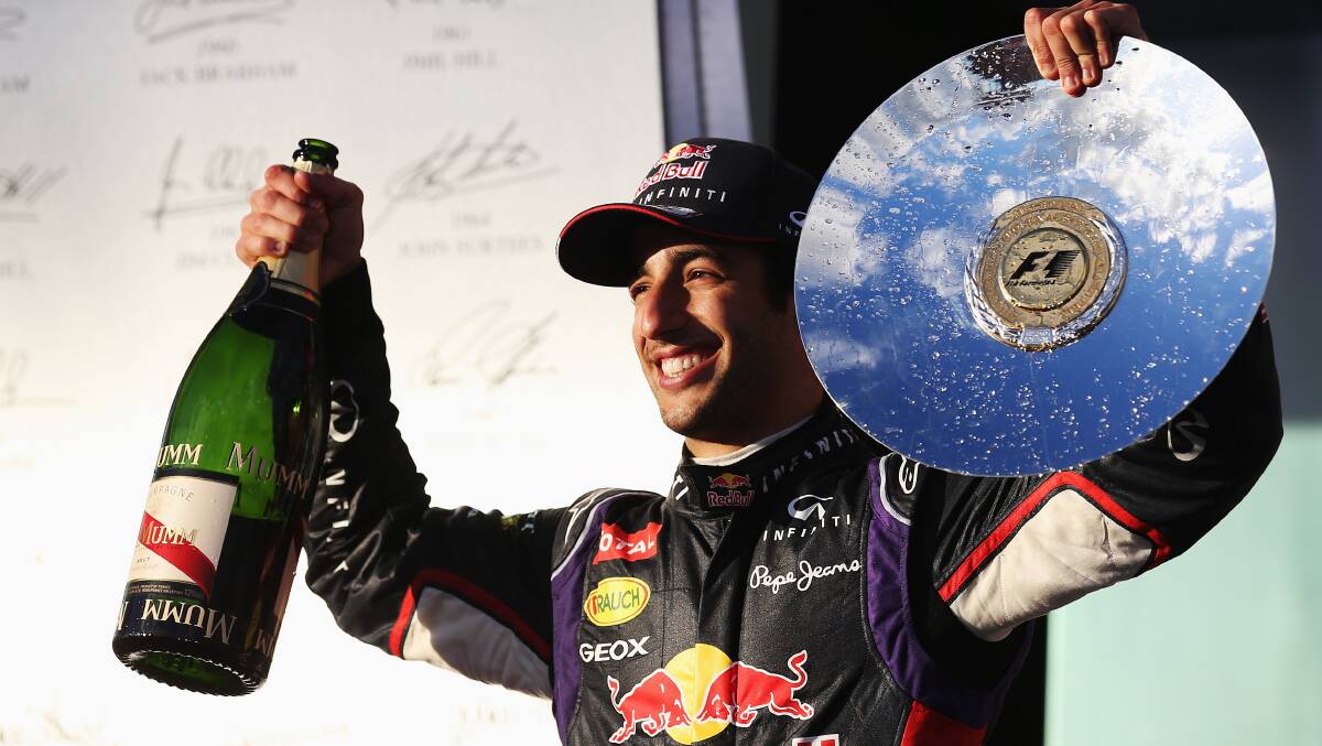 Daniel Ricciardo of Australia and Infiniti Red Bull Racing celebrates on the podium after finishing second. PHOTOS: GETTY IMAGES