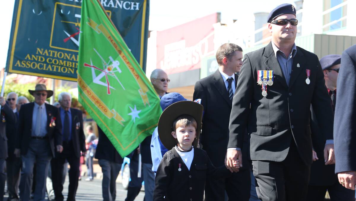 Anzac Day 2014 Banna Ave Griffith, Lindsay Flack with his son Austin 5. 