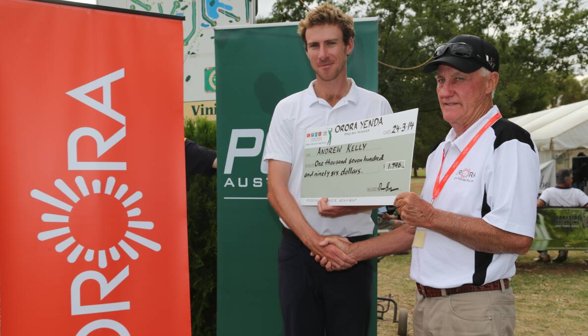 STRAIGHT TO THE BANK: Victorian Andrew Kelly accepts the winner's cheque from Yenda Golf Club president Denis Murphy after taking out Monday's pro-am.