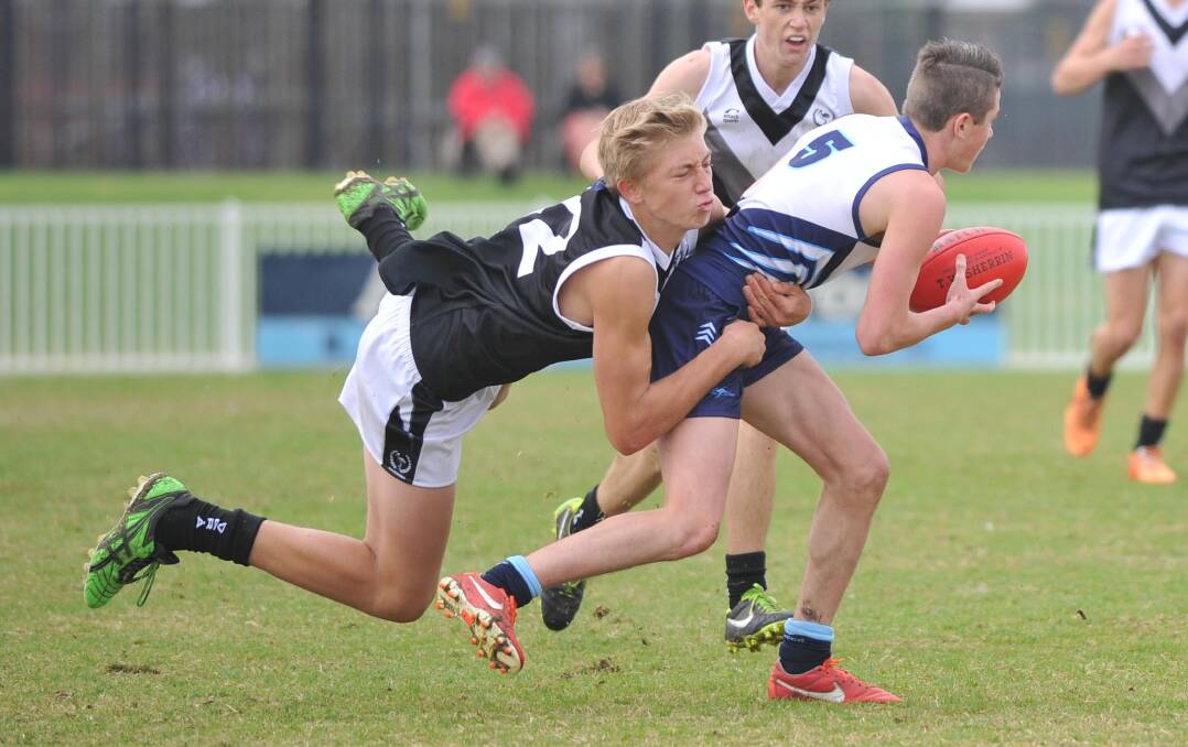 A STAR IS BORN: Nathan Richards lays a tackle during last week's NSW Combined High Schools AFL carnival in Wagga. Richards' efforts helped earn him a guernsey for the NSW under 15 side, which will head off for the national championships next month. Picture: The Daily Advertiser
