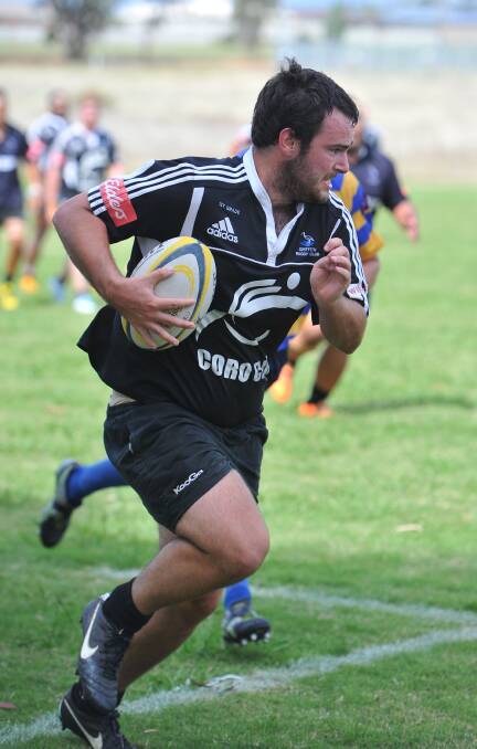 TEARING AWAY: Nick Gleeson streaks away with the ball for the Blacks in Saturday's SIRU knockout clash against Albury.
