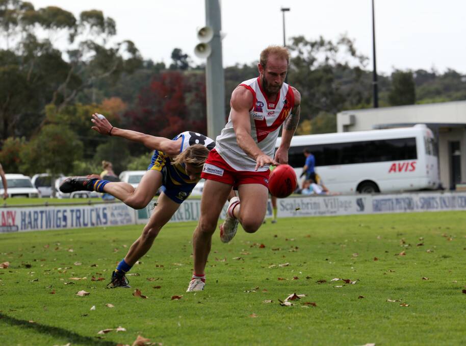 TEARING AWAY: Griffith's Guy Orton takes a bounce on Saturday after sprinting clear of his Mangoplah-CUE opponent.