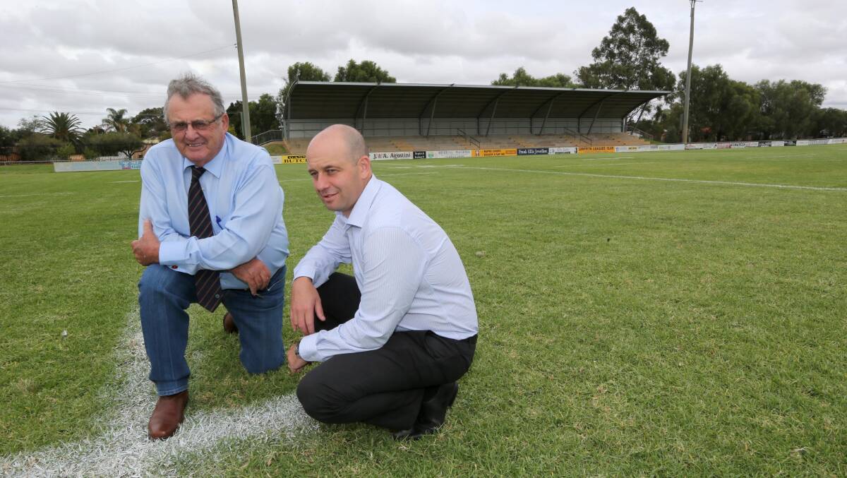 UP TO SCRATCH: Mayor John Dal Broi shows NRL head of football around EW Moore Oval, the venue that looks set to host the Canberra Raiders and the Canterbury-Bankstown Bulldogs in early 2015.
