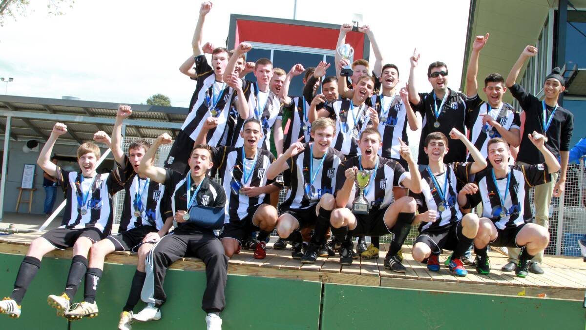 CHAMPIONS: The West Griffith under 18s side celebrating their grand final win last year.