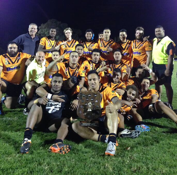 SHIELD CHAMPIONS: The Waratah Tigers celebrate after reclaiming the Doug Alpen Memorial Shield on Friday.