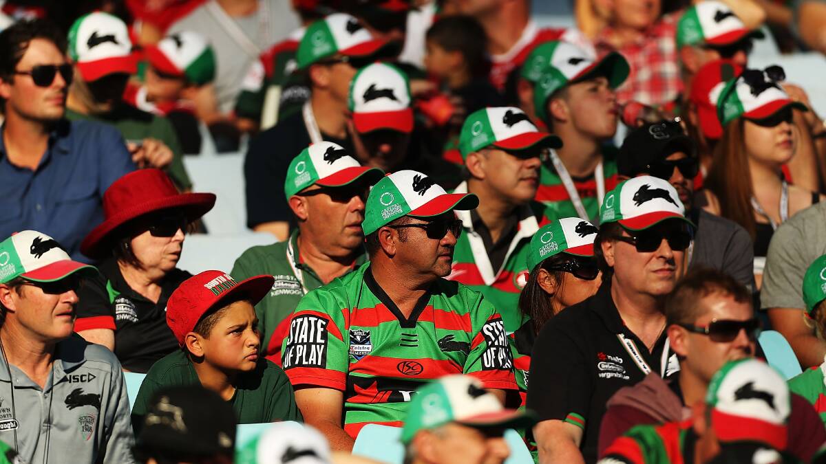 Rabbitohs fans watch the round seven NRL match between the South Sydney Rabbitohs and the Canterbury-Bankstown Bulldogs at ANZ Stadium on April 18, 2014 in Sydney, Australia. Photo: Mark Metcalfe/Getty Images.