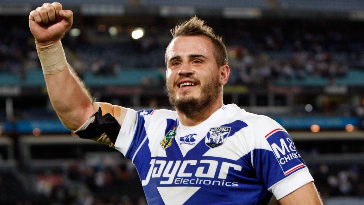 Josh Reynolds of the Bulldogs celebrates his teams win at the round seven NRL match between the South Sydney Rabbitohs and the Canterbury-Bankstown Bulldogs at ANZ Stadium on April 18, 2014 in Sydney, Australia. Photo: Renee McKay/Getty Images