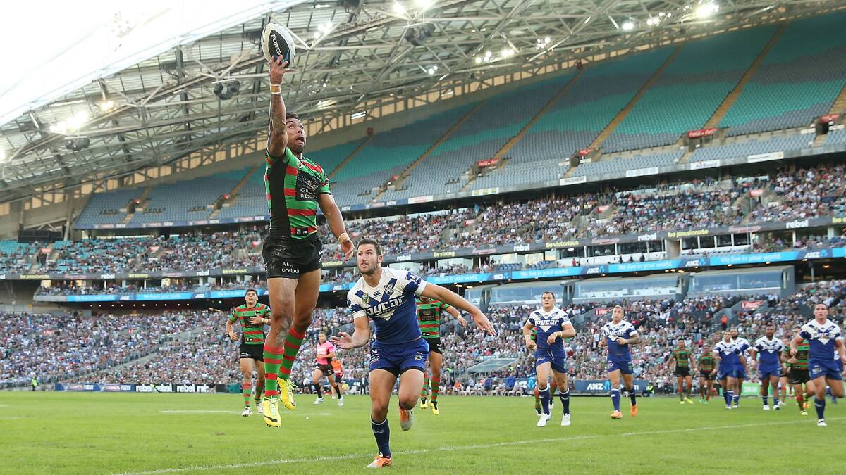  Nathan Merritt of the Rabbitohs fails to gather the ball over the try line as he is tackled by Mitch Brown of the Bulldogs during the round seven NRL match between the South Sydney Rabbitohs and the Canterbury-Bankstown Bulldogs at ANZ Stadium on April 18, 2014 in Sydney, Australia. Photo: Mark Metcalfe/Getty Images.