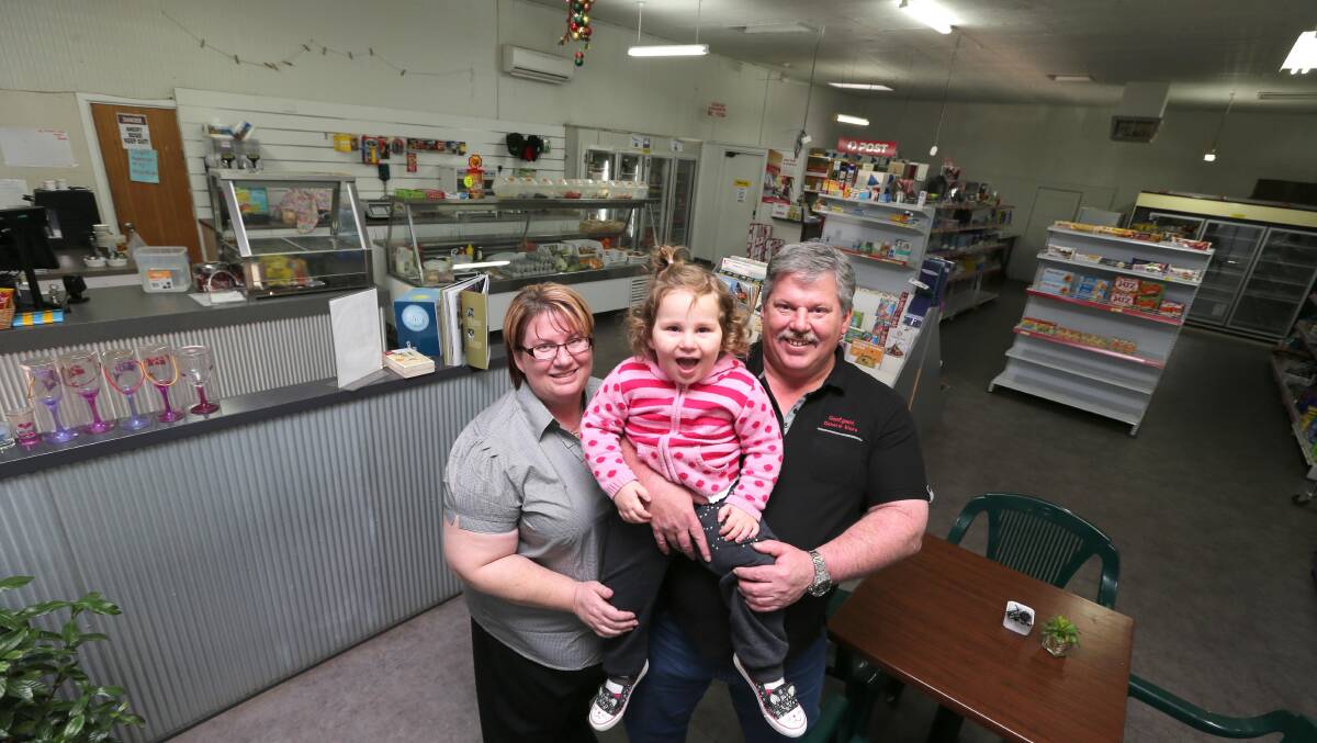 BACK IN BUSINESS: New Goolgowi Store owners, Serena Thompson and Mike Brown, with their daughter Temperance Brown, 2, are delighted they made the move from the city. Picture: Anthony Stipo.
