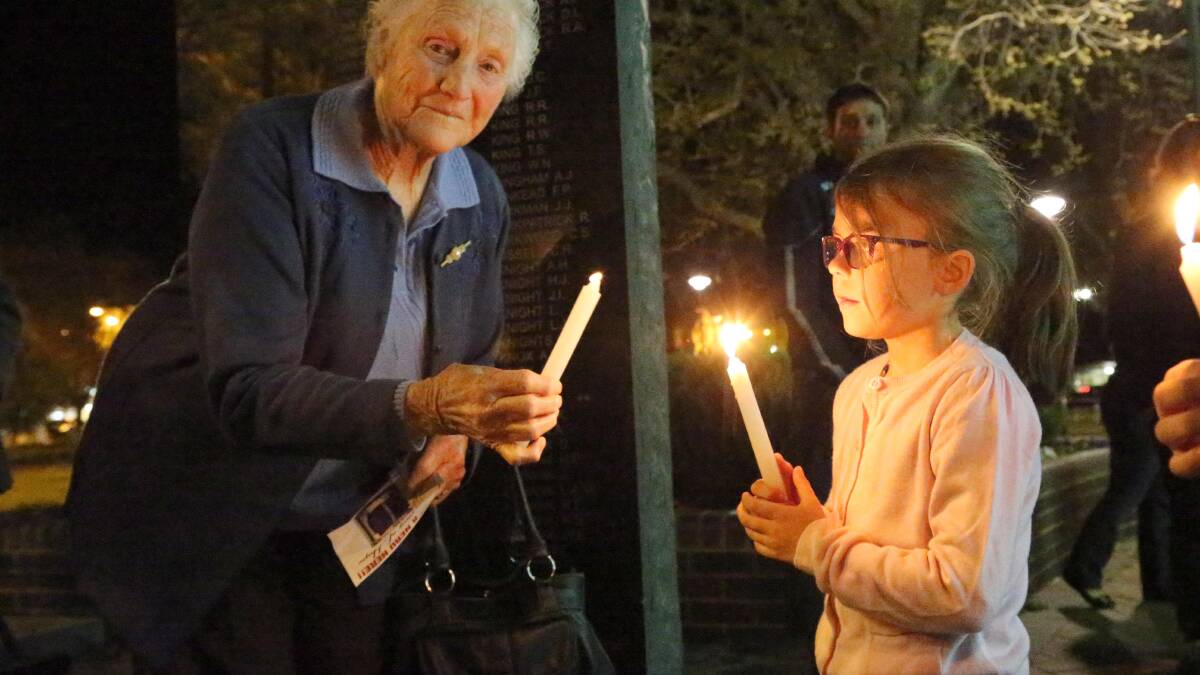SHOW OF SUPPORT: Mary Quarisa and Chloe Vidler are among those who gathered at the vigil at Memorial Park on Friday night. Picture: Anthony Stipo