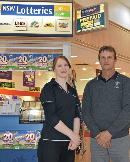MAKING HEADLINE: News Express manager Emma Hardie and Dave Overs get ready for Griffin Plaza's Market Day.