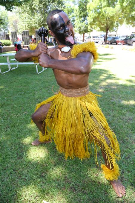 SHOWCASE: Fijian dancer Bill Sorrow puts on a show at the Griffith Multicultural Festival on Saturday in Memorial Park. Picture: Anthony Stipo