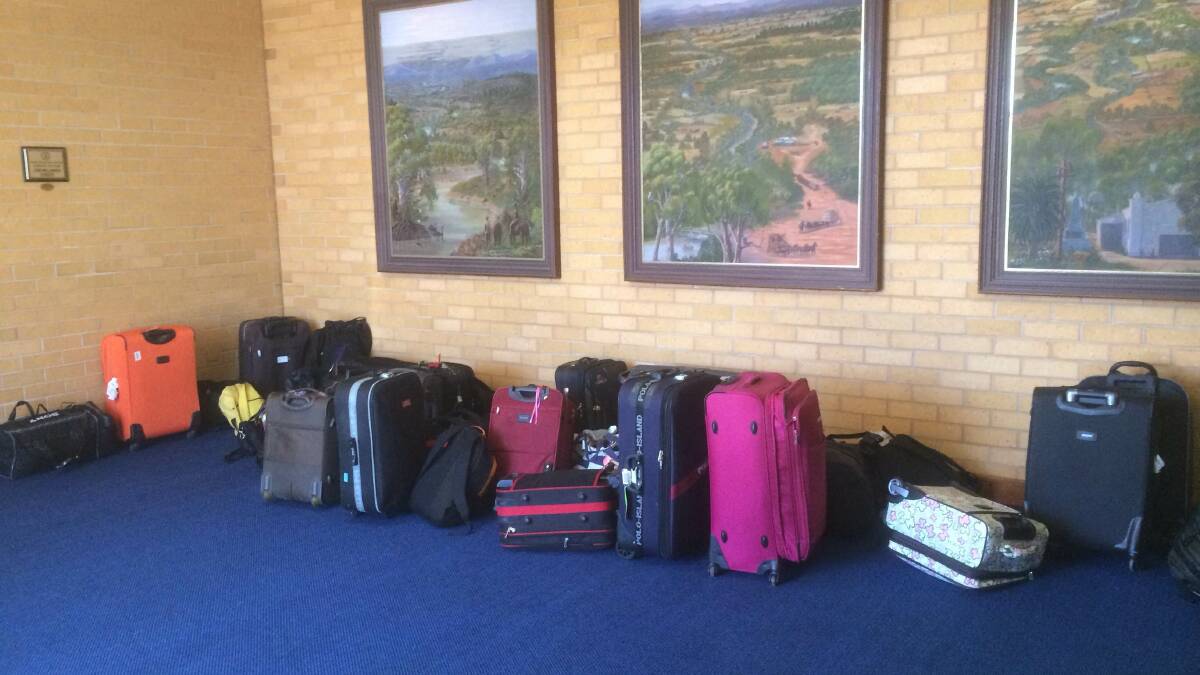 DETAINED: Luggage litters the foyer of the hall at the Hillston Community Centre.