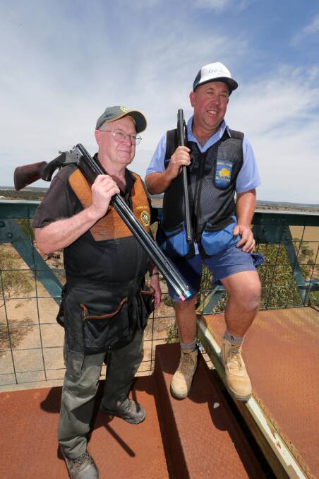 MISSING THE HEAT: Griffith shooters Warren Brown (left) and Greg Allen are preparing for cold conditions in New Zealand. Picture: Anthony Stipo