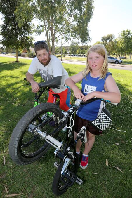 TRICKY PAIR: Matt Spencer and son Richie like to compete in BMX flatland competitions. Picture: Anthony Stipo