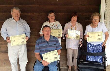 Long-serving volunteers at Pioneer Park Museum - some who have volunteered for up to 30 years - are pictured with certificates of recognition they received from Griffith Mayor John Dal Broi at the annual Christmas celebrations held at the museum.