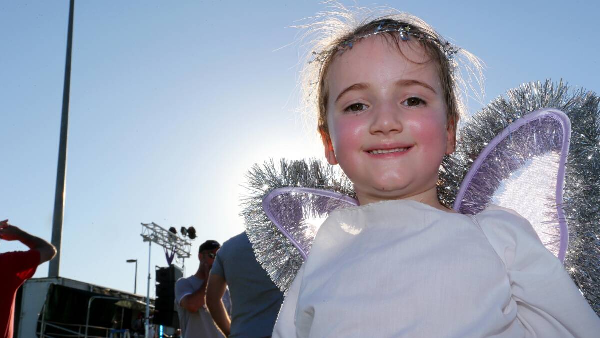 MAGIC NIGHT: Little Layla Codemo, 4, makes a gorgeous angel on Sunday at Griffith Carols by Candlelight.