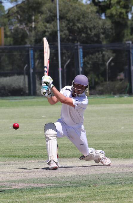 CRACK: Exies batsman Justin Winkler smacks the ball through the offside. Picture: Anthony Stipo.