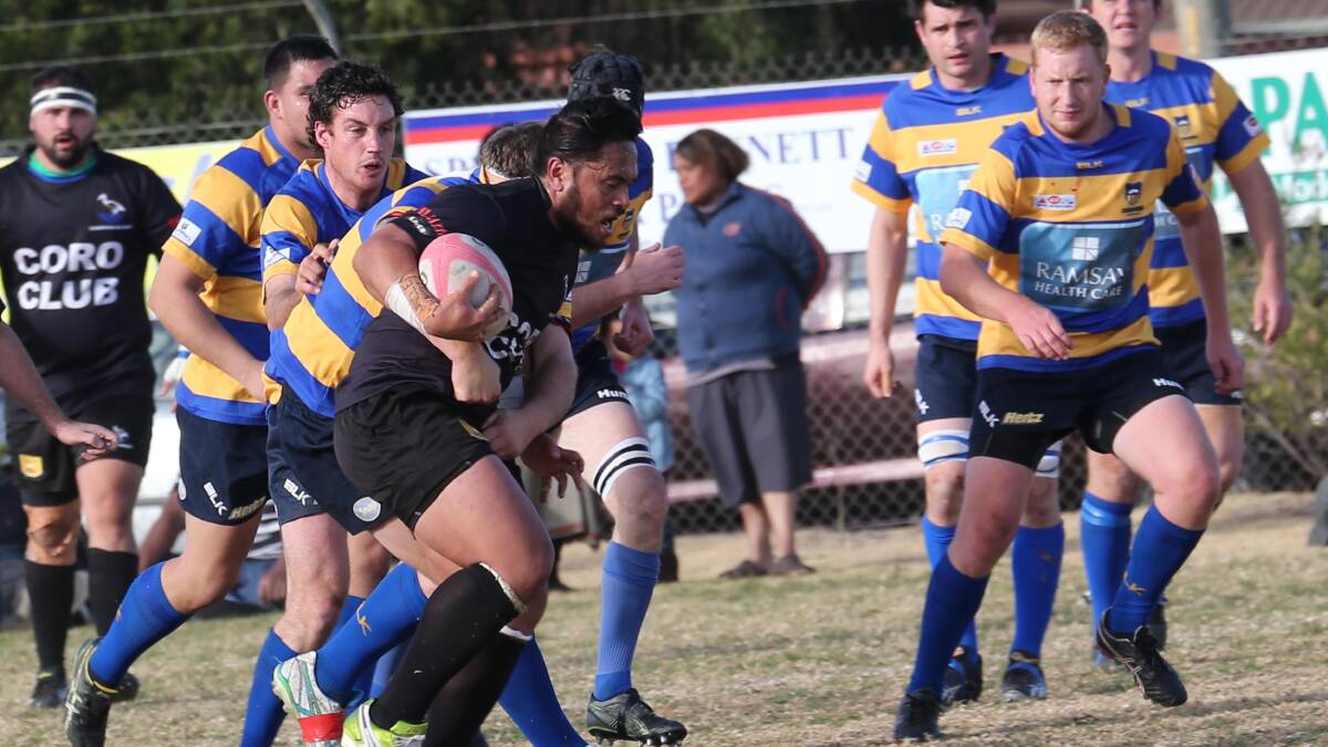 SLUGGED: Griffith Blacks prop Chris Latu is tackled by his Albury opponent. Rugby union clubs faced increased fees for next season. Picture: Anthony Stipo