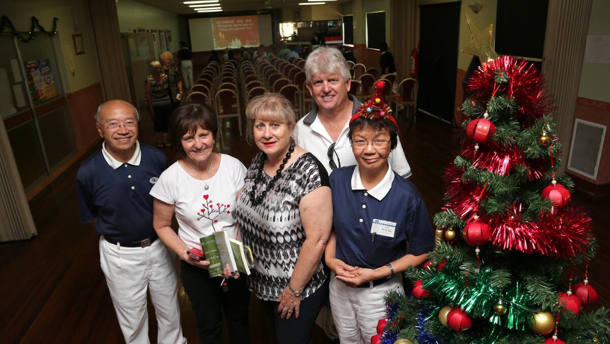 SPREADING CHEER: Tzu Chi CEO Stephen Kan, Griffith City Council's Peta Dummett, Ann Napoli and Brett Stonestreet and Tzu Chi Commissioner enjoy the Christmas party at the Yenda Diggers Club. Picture: Anthony Stipo