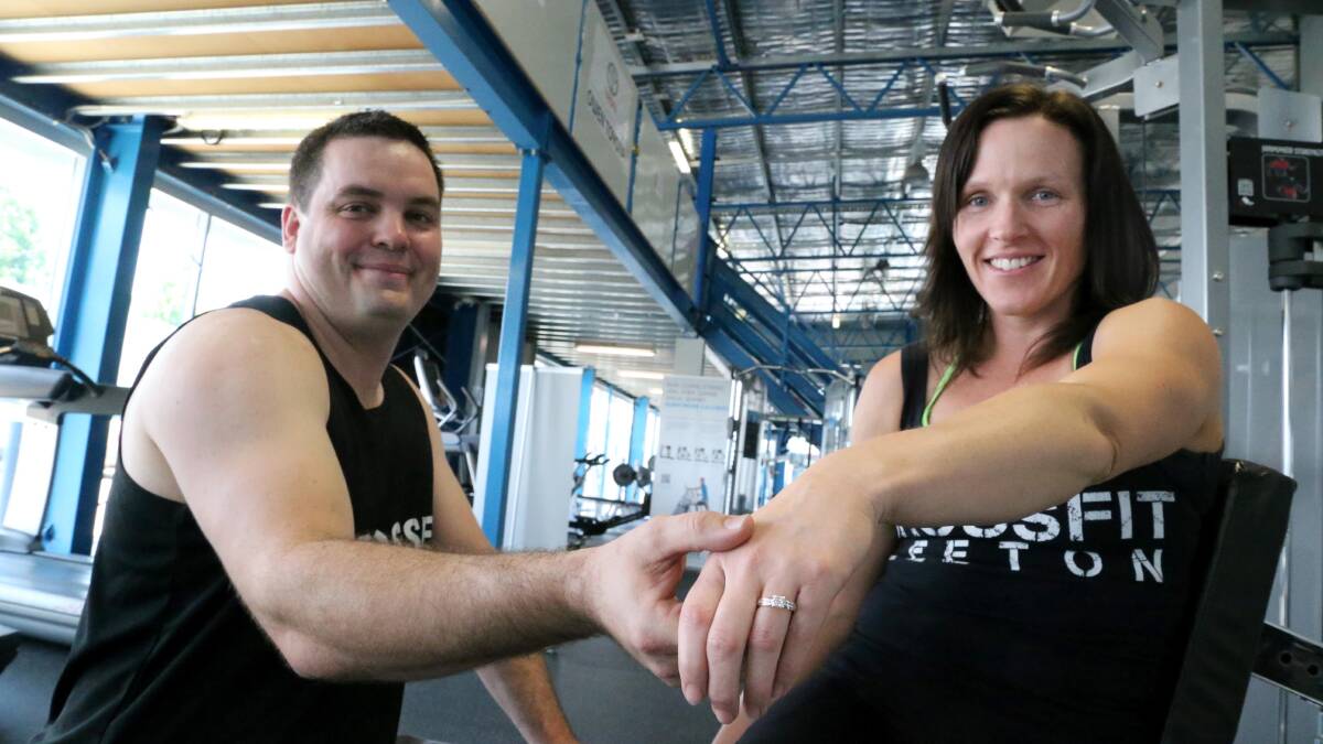 SHE SAID YES: Evan Sloan proposes to his surprised partner Susan Yates at Livefit's Crossfit competition.