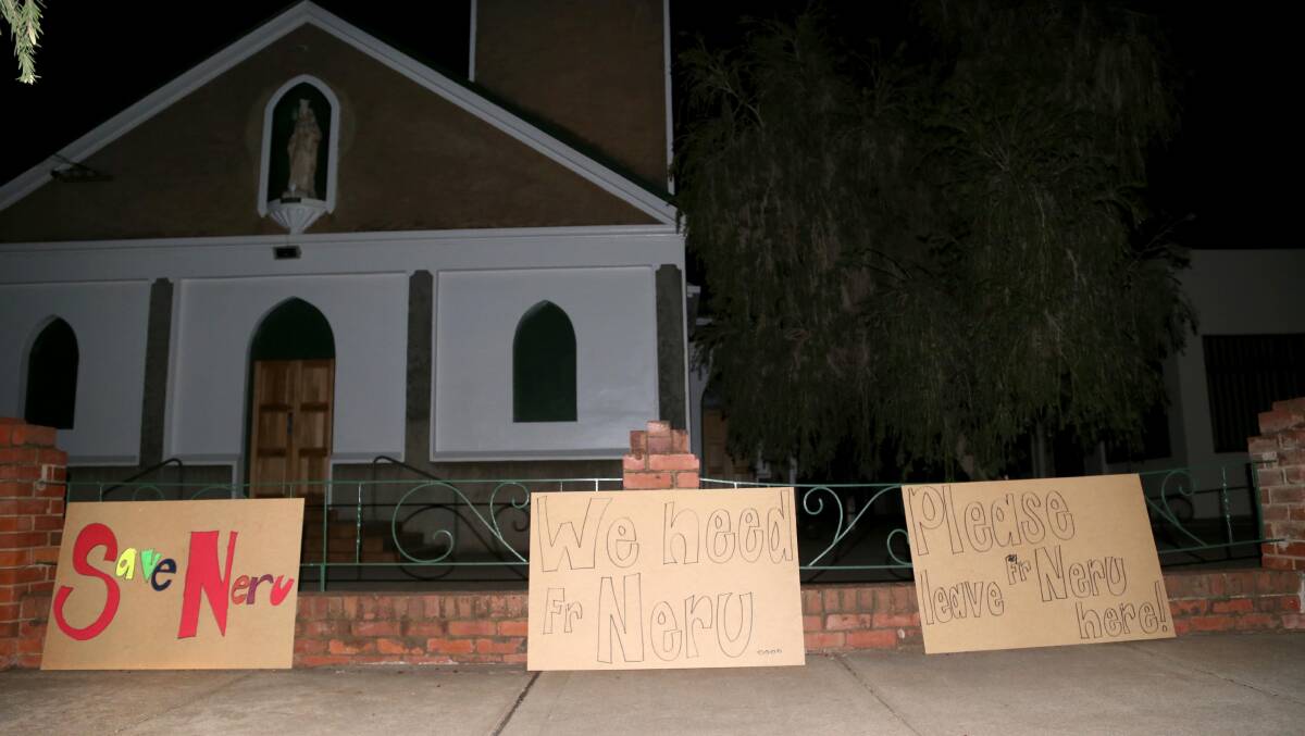 COMMUNITY RALLIES: Members of the public put up these signs in a bid to keep him in the parish. Picture: Anthony Stipo