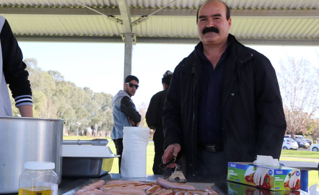 A HELPING HAND: Nadher Ghafferi, who helps refugees settle in to Griffith, helped organised a barbecue for Refugee Week.