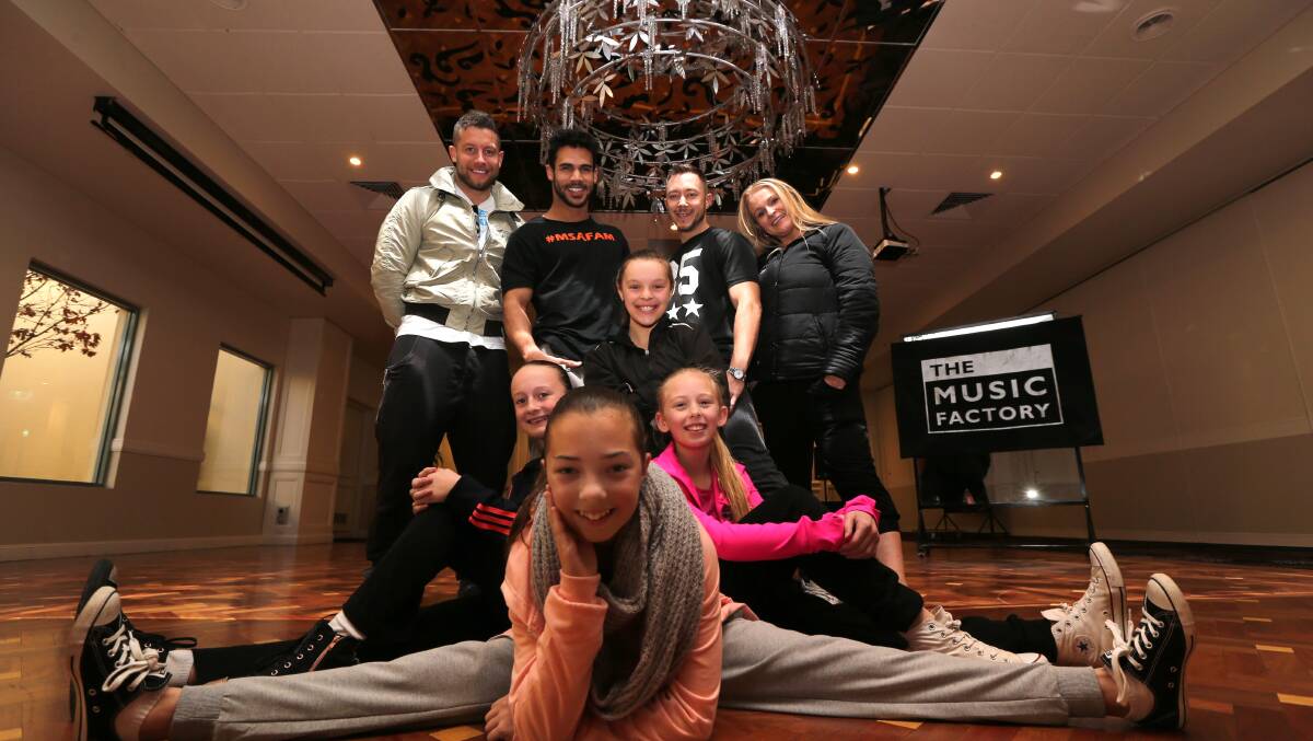DREAM OPPORTUNITY: Workshop organiser Linton Farlow with Britney Spears' back-up dancers Willie Gomez and Zac Brazenas, SDS Griffith director Shannon Hart and Anastasia Comarin, 12, Madeleine De Bortoli, 11, Felicity Grady, 10 and Jemma Rovere, 12. Picture: Anthony Stipo.