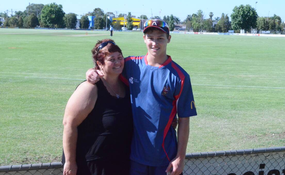 SHOCKED: Jodie Patterson, with son Ben, feels for cricketers following the death of Phillip Hughes.
