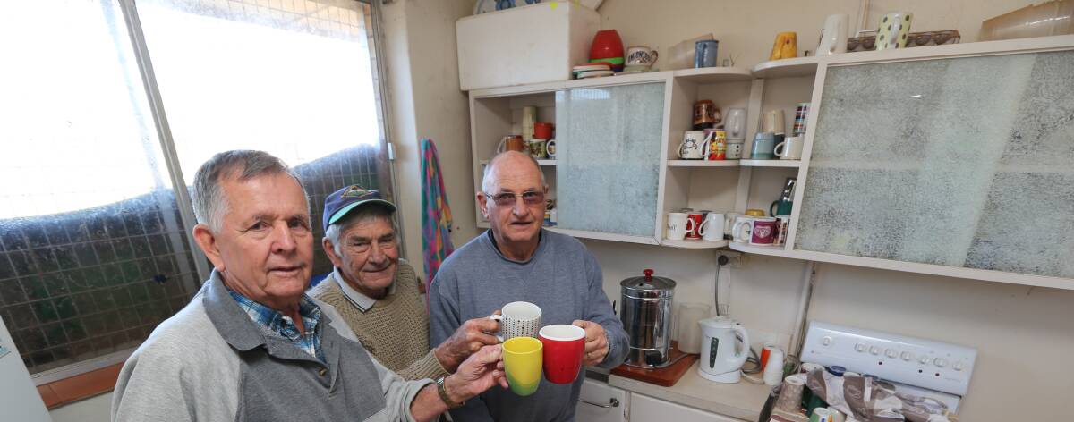 COOKING WITH GAS: The Griffith Shed for Men members Jack Vearing, Doug Melville and Ralph Savage celebrate receiving funds to give their kitchen a facelift. Picture: Anthony Stipo.