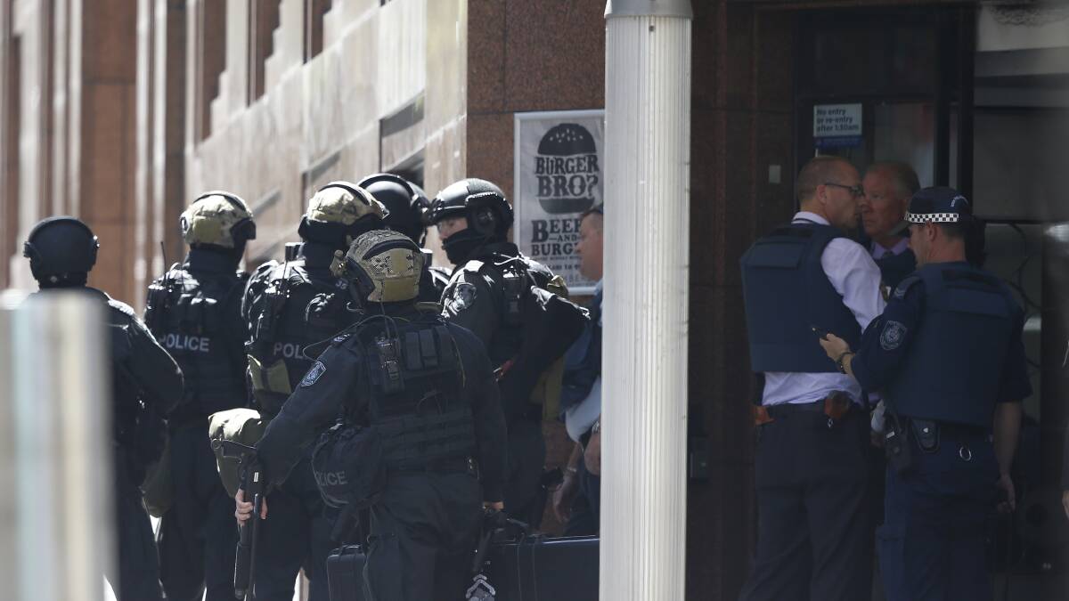 TERRIFYING: Witnesses say a man with a gun is holding hostages at Lindt Cafe in Martin Place.
