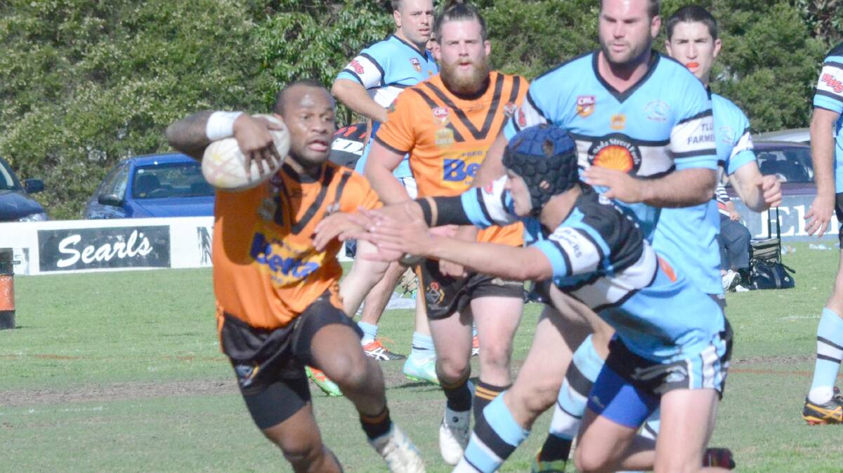 GET AWAY: Waratahs five-eighth David Rauluni tries to round the TLU defence in Sunday's Group 20 preliminary final.