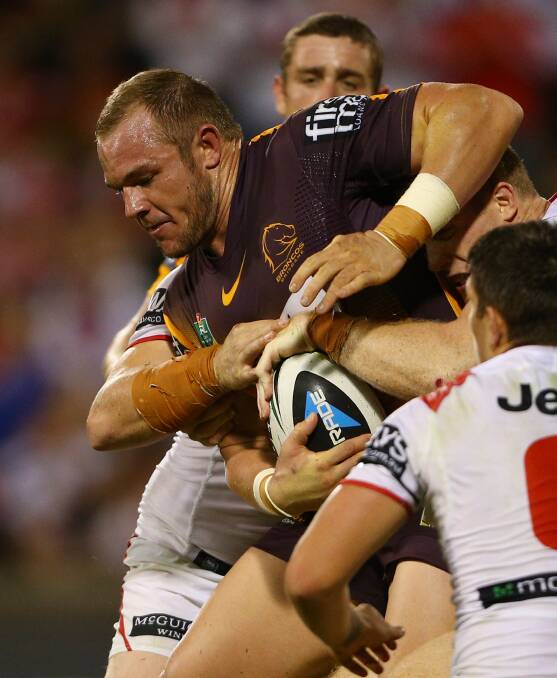  Martin Kennedy of the Broncos is tackled by the Dragons defence. Picture: Getty