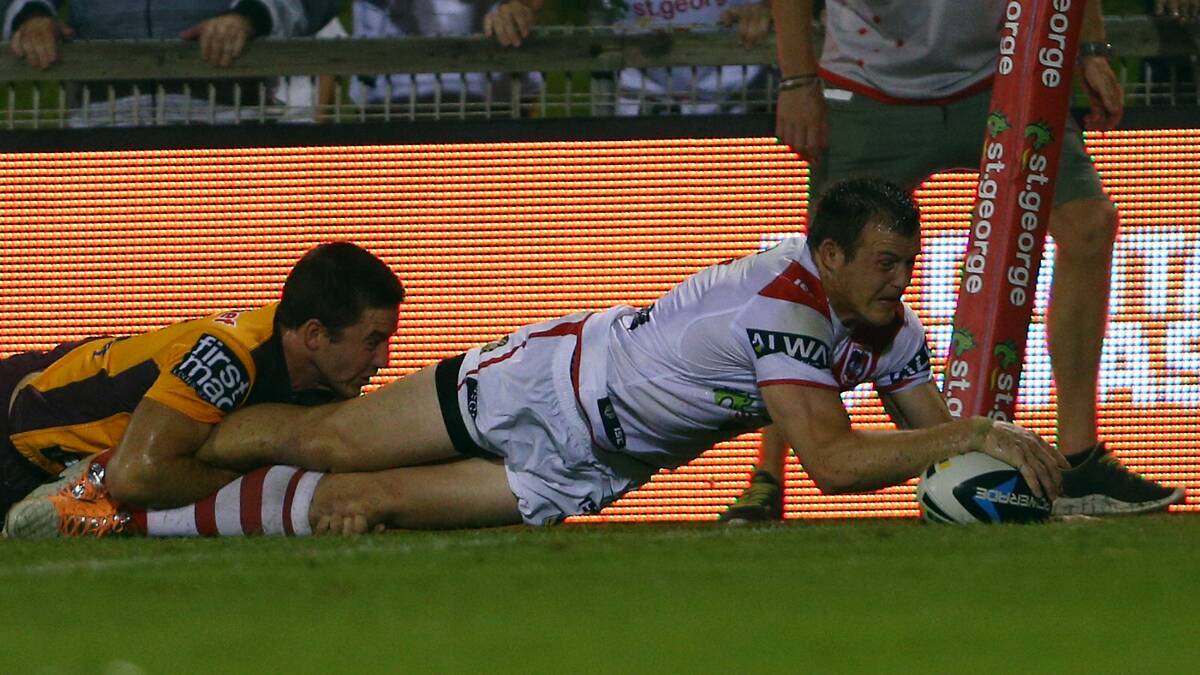Brett Morris of the Dragons scores a try in the tackle of Lachlan Maranta during the round four NRL match. Picture: Getty