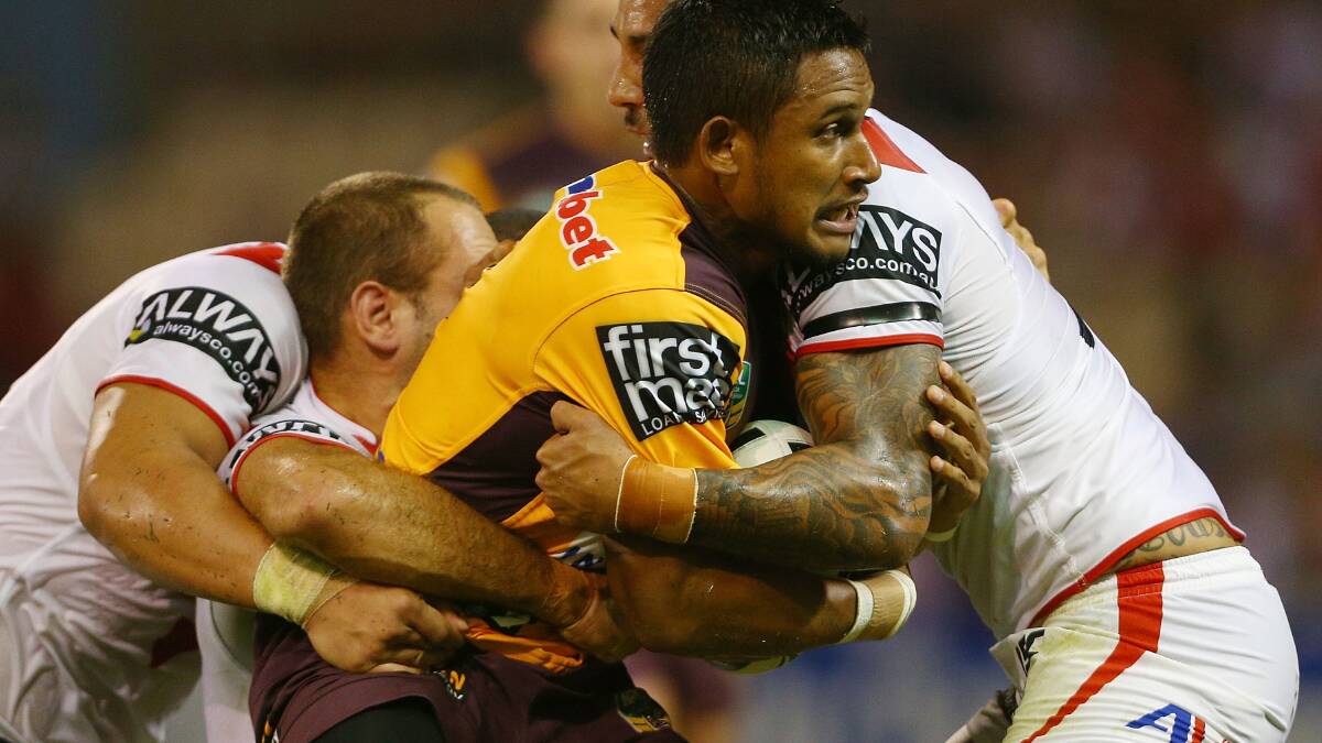 Ben Barba of the Broncos is tacked by Dylan Farrell and Jason Nightingale during the round four NRL match between the St George Illawarra Dragons and the Brisbane Broncos at WIN Stadium. Picture: Getty