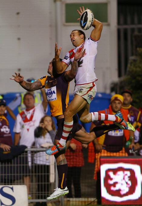  Jason Nightingale of the Dragons and Daniel Vidot of the Broncos jump for the high ball during the round four NRL match between the St George Illawarra Dragons and the Brisbane Broncos. Picture: Getty