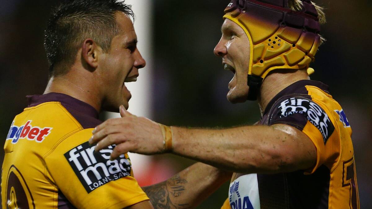 Todd Lowrie of the Broncos celebrates his try with team mate Corey Parker during the round four NRL match between the St George Illawarra Dragons and the Brisbane Broncos. Picture: Getty