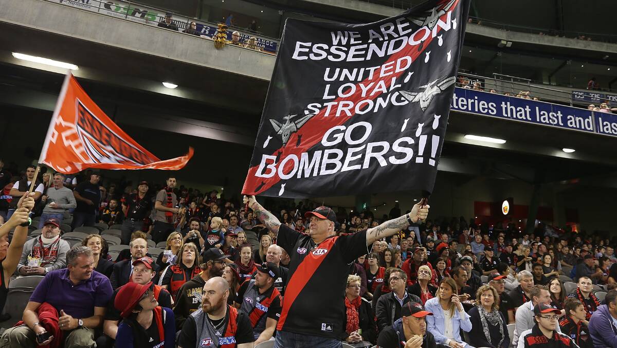 Bombers fans show their support during the AFL Round two match between the Essendon Bombers and the Hawthorn Hawks at Etihad Stadium on March 28. Picture: Getty