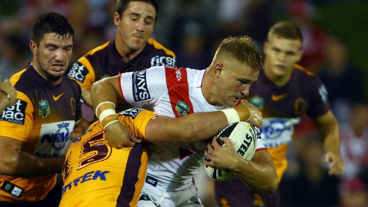 Jack de Belin of the Dragons is tackled by the Bronco's Martin Kennedy Picture: Getty