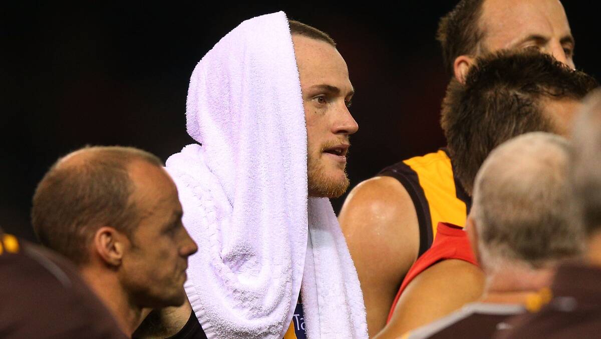  Jarryd Roughead of the Hawks cools down with a wet towel during the AFL Round two match between the Essendon Bombers. Picture: Getty