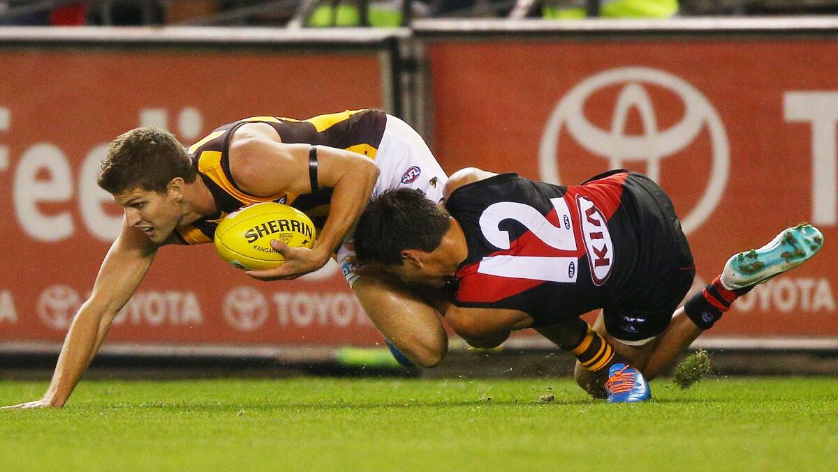 Mark Baguley of the Bombers tackles Luke Breust of the Hawks. Picture: Getty