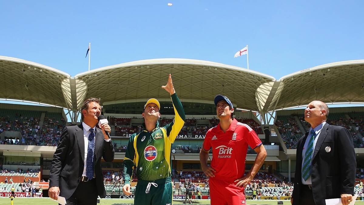 Michael Clarke of Australia and Alastair Cook of England are seen at the coin toss prior to game five of the One Day International Series between Australia and England. Picture: Getty.