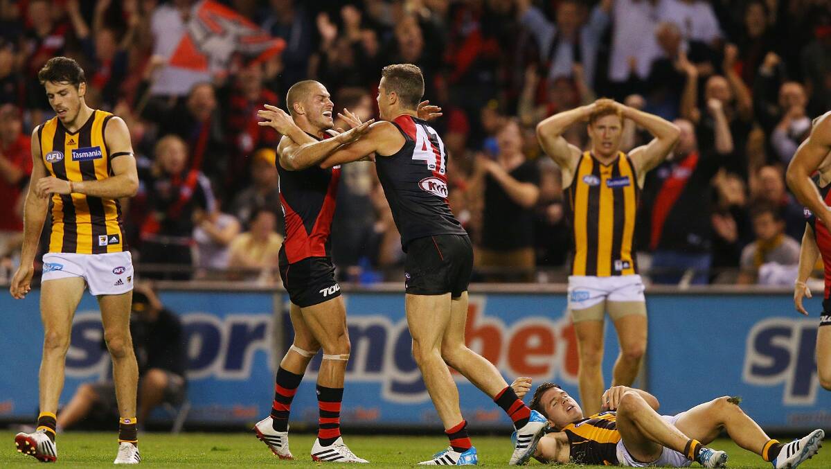 Patrick Ambrose and David Zaharakis of the Bombers celebrate a goal during the AFL Round two match between the Essendon Bombers and the Hawthorn Hawks. Picture: Getty
