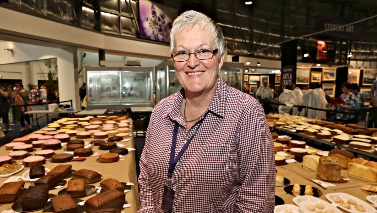 BAKING QUEEN: Barbara Goldman who entered 19 perishable categories and seven non-perishable categories in the cake competition looks over her competitors' creations at the Sydney Royal Easter Show. 