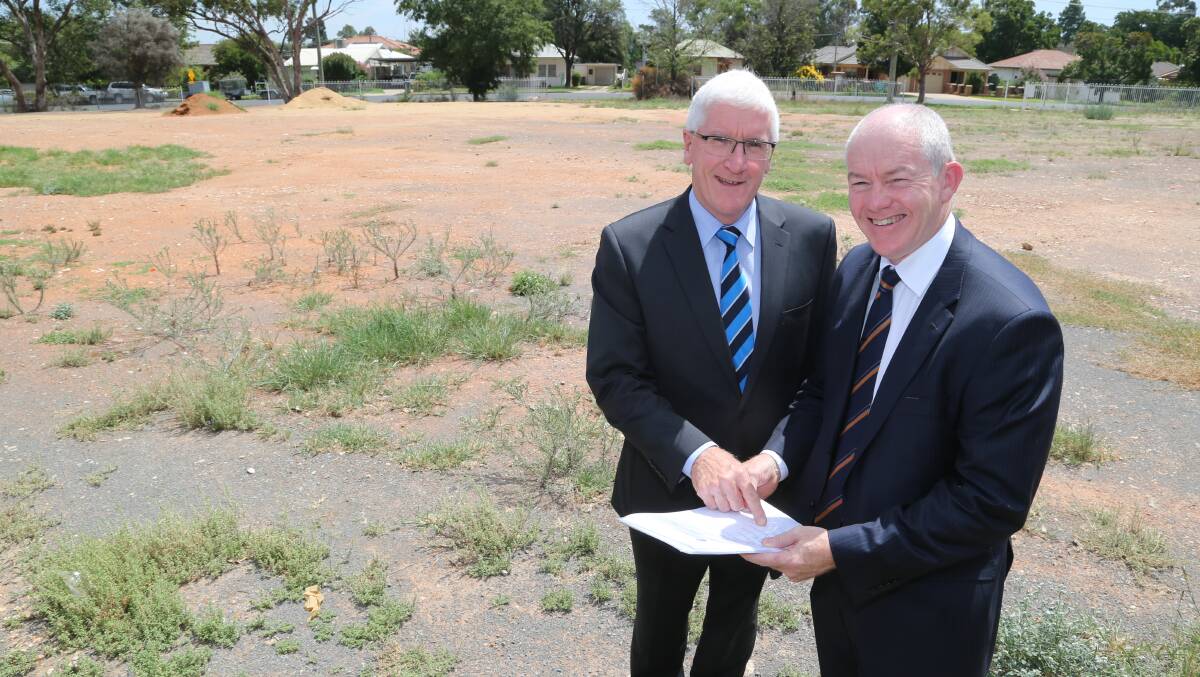 HEALTHY PROGRESS: CEO of the private hospitals division St Vincent’s Health Australia Martin Day checks plans with CEO of St Vincent’s Private Robert Cusack in Griffith.