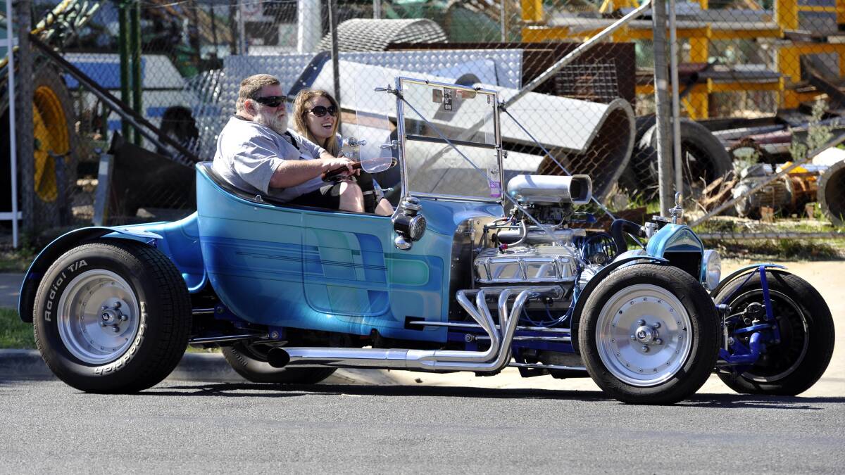 JUNEE: David Peters, of Hilltop, and Natalie Ford, from Griffith, in Dave's 1923 T Bucket Ford. The cars came across from Narrandera, where the big Hot Rod spectacular is being staged. Picture: Les Smith, The Daily Advertiser
