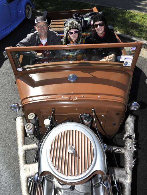 JUNEE: The Stokoe family - Phil (left), Scarlett, 11, and Carolyn - from Ashfield in their 1930 Roadster Pickup A model. The cars came across from Narrandera, where the big Hot Rod spectacular is being staged. Picture: Les Smith, The Daily Advertiser