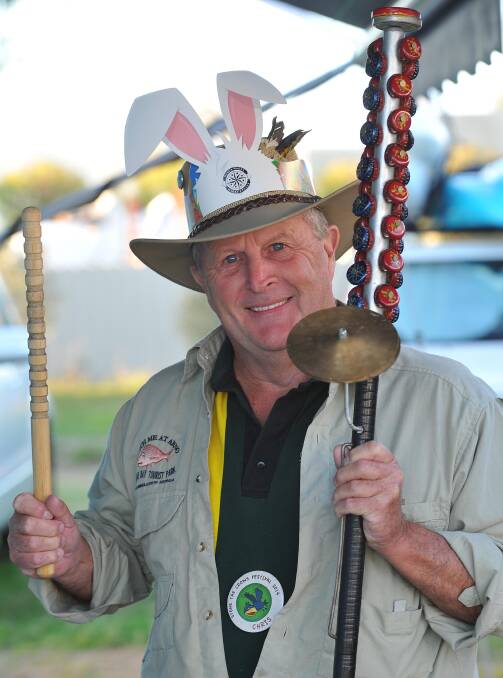 WAGGA: Chris Wilson from Mansfield in Victoria with his lagerphone comprising 150 stubbie caps at the Stone the Crows Festival on Saturday. Picture: Kieren L Tilly, The Daily Advertiser