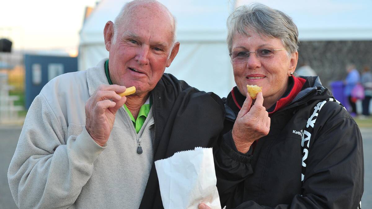 WAGGA: Fred Leech and Enid Leech from Silverwater, via Lake Macquarie, enjoy some hot chips at the Stone the Crows Festival on Saturday. Picture: Kieren L Tilly, The Daily Advertiser